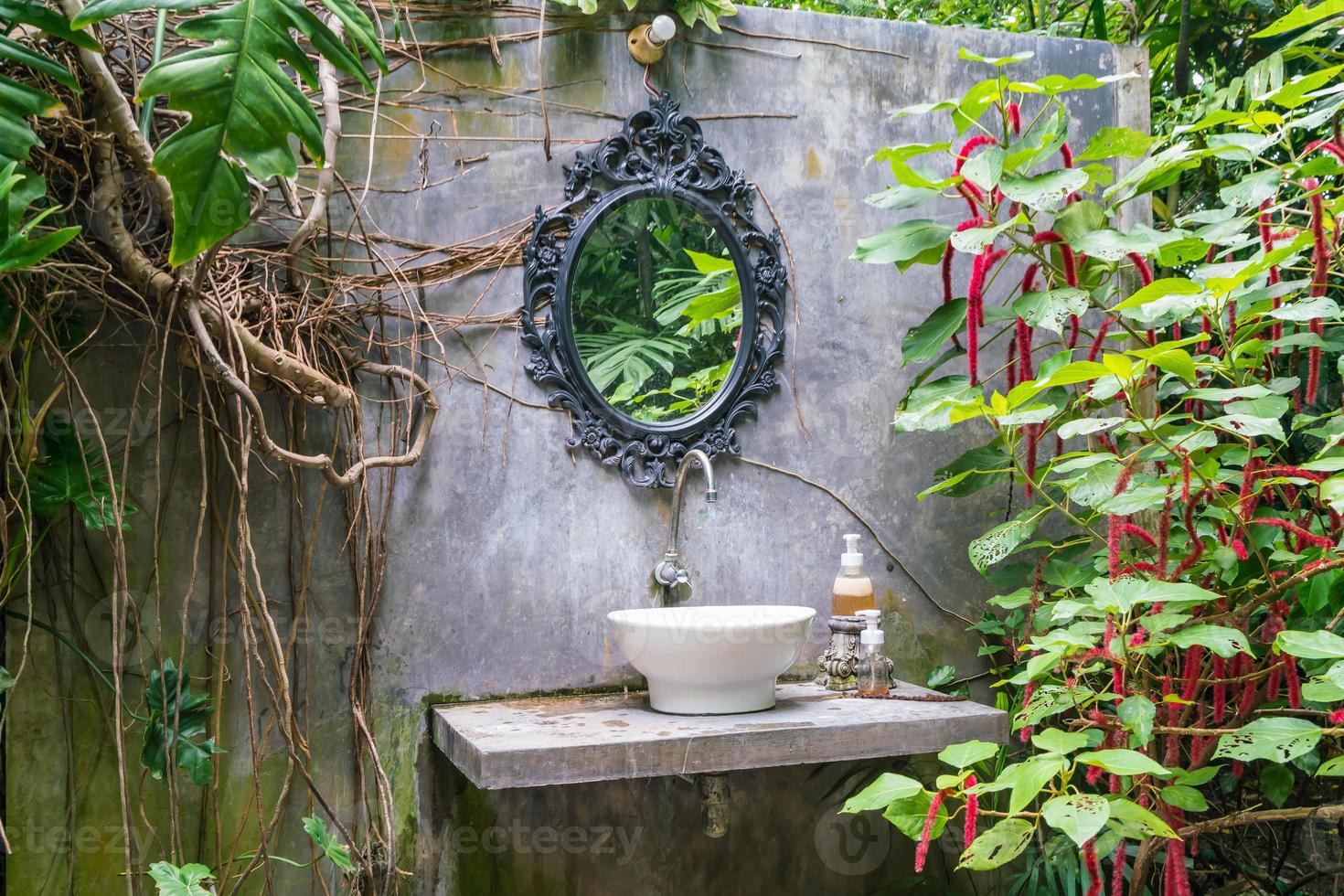 Mirror and sink decoration of bathroom in vintage style photo