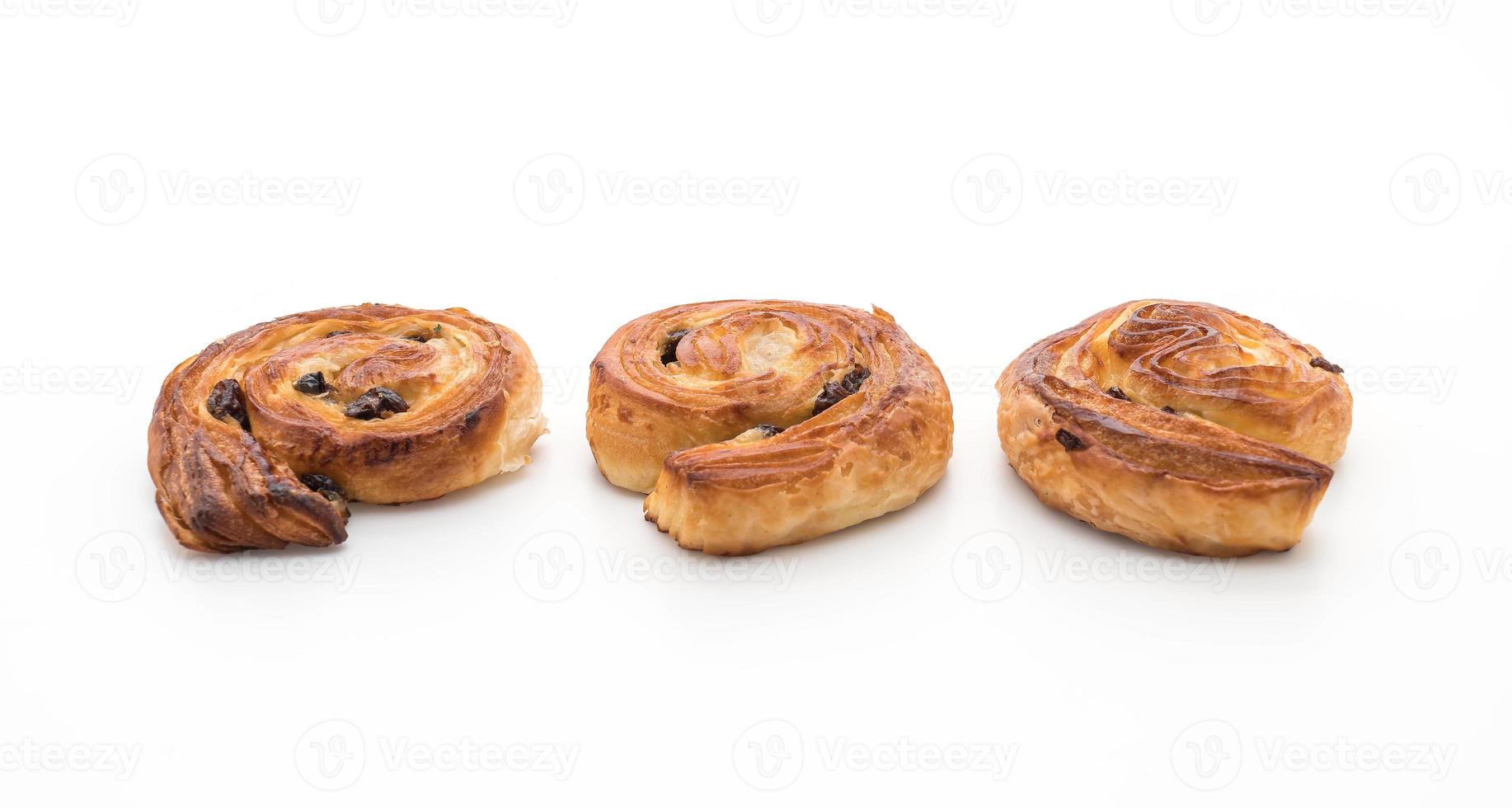 Cinnamon raisin roll on white background photo