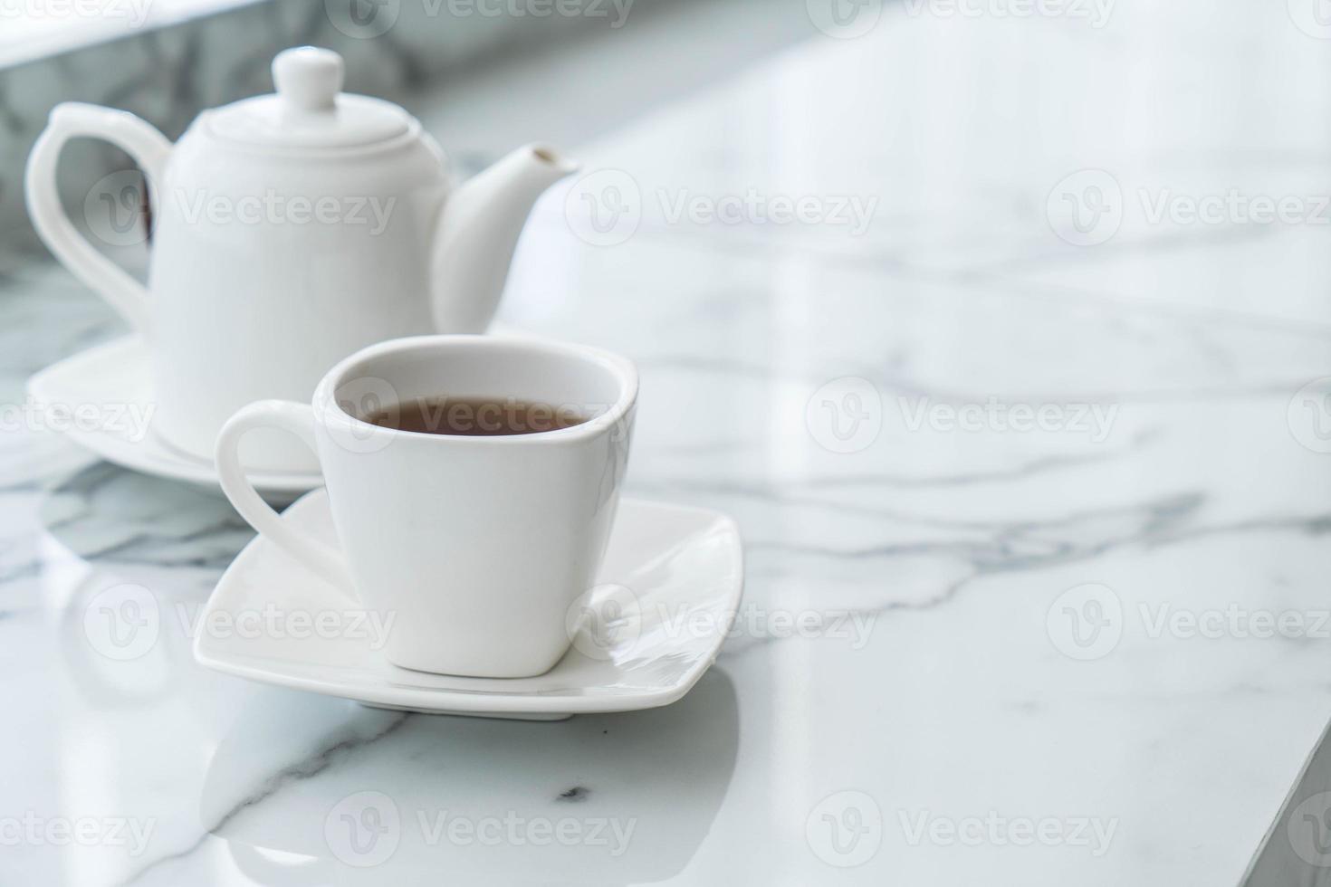 Hot tea cup on the table photo