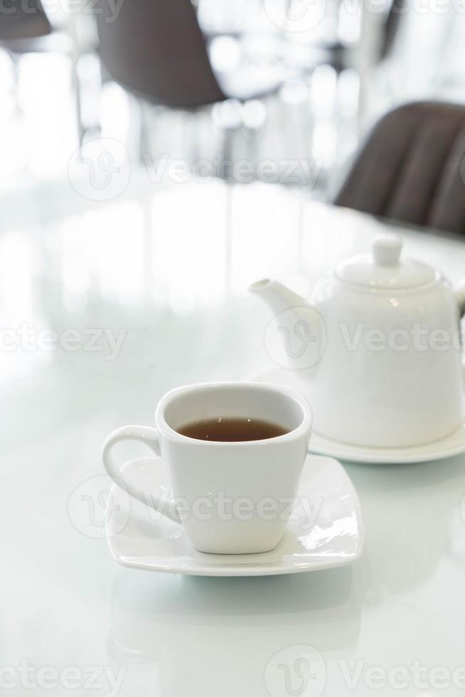 Hot tea cup on the table photo