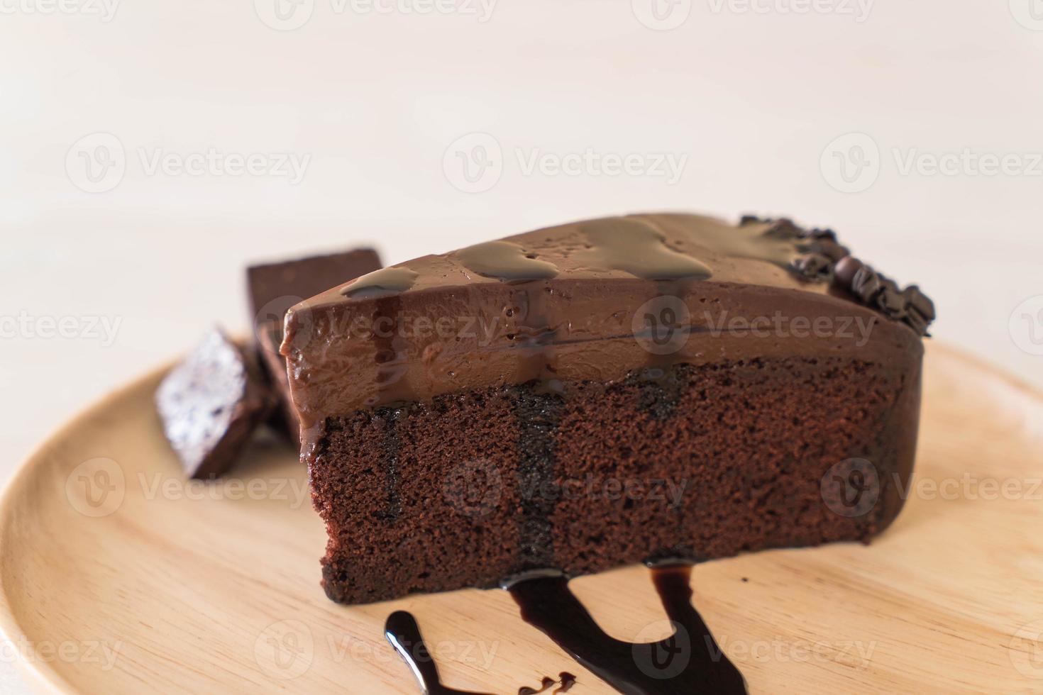 Chocolate cake on wood plate photo