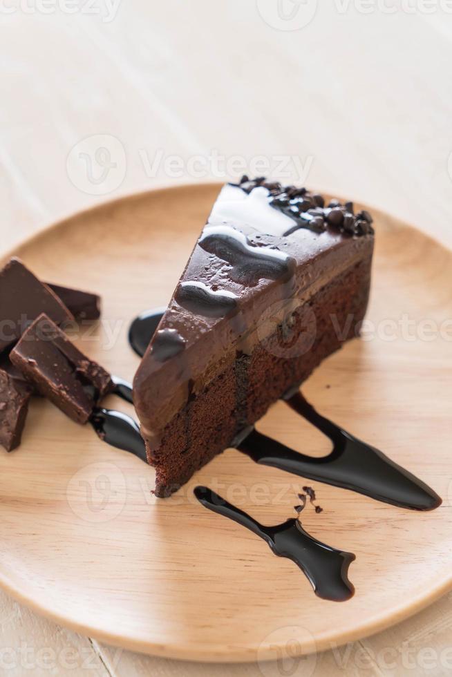 Chocolate cake on wood plate photo