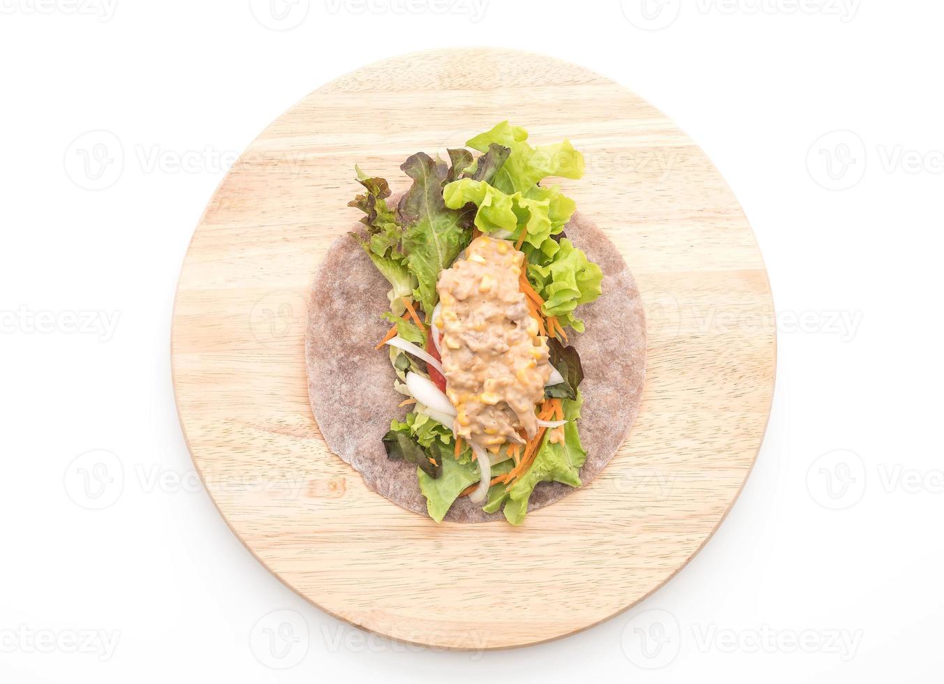 Wrap salad roll with tuna corn salad on white background photo