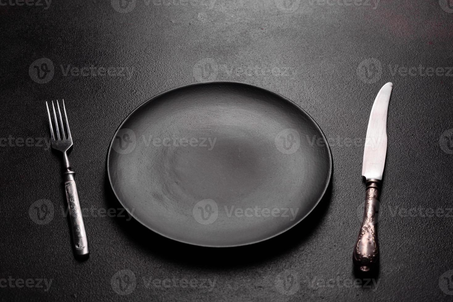 Set of tableware ready for the meal with black copy space photo
