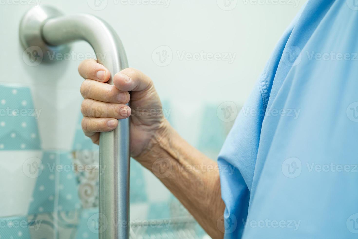 Asian senior woman patient use handle security photo