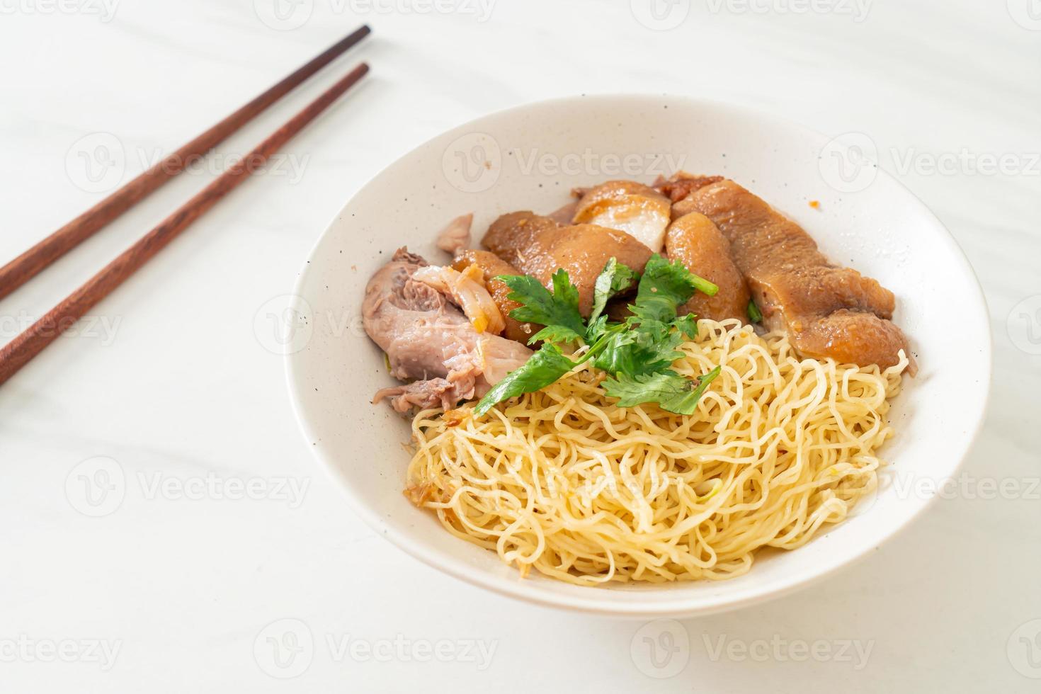 Dried stewed pork leg noodles bowl - Asian food style photo