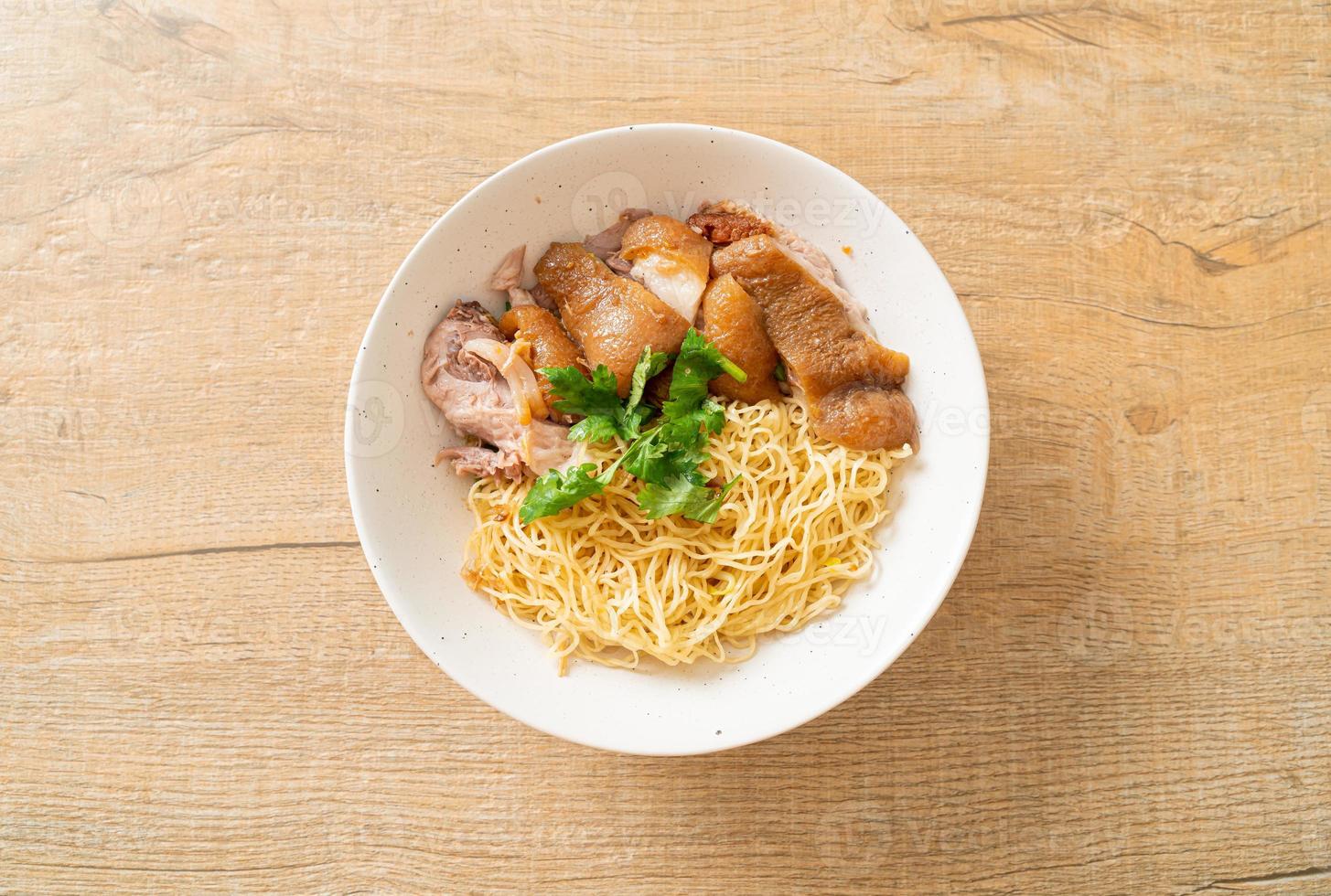 Dried stewed pork leg noodles bowl - Asian food style photo