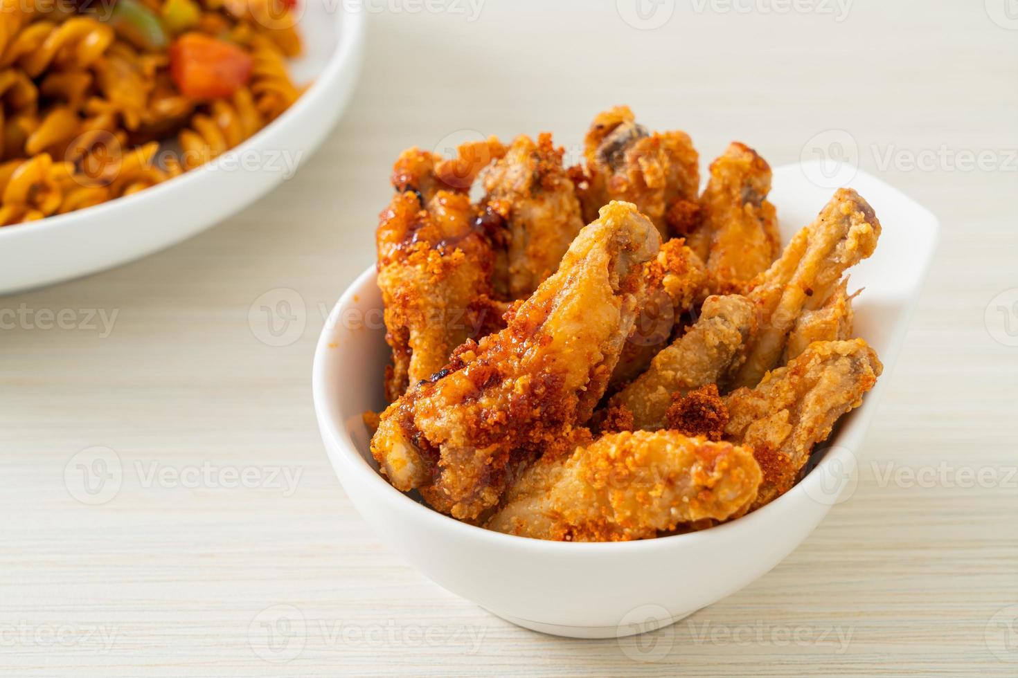 Fried barbecue chicken wings in white bowl photo