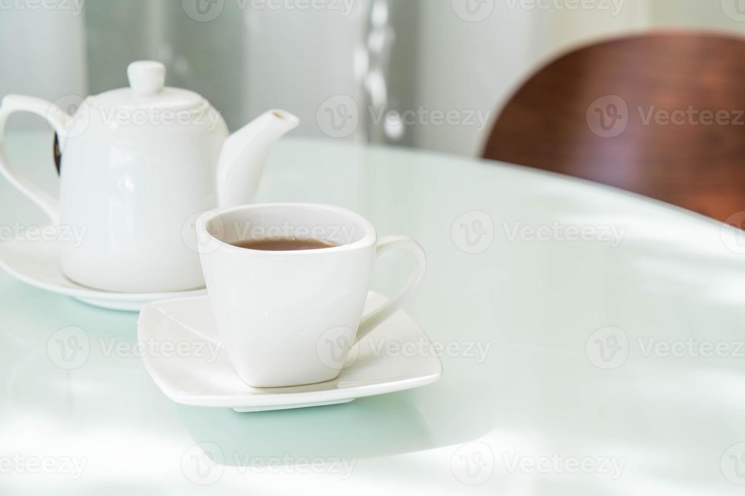 Hot tea cup on the table photo