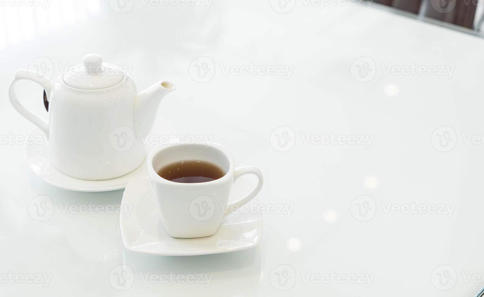 Hot tea cup on the table photo