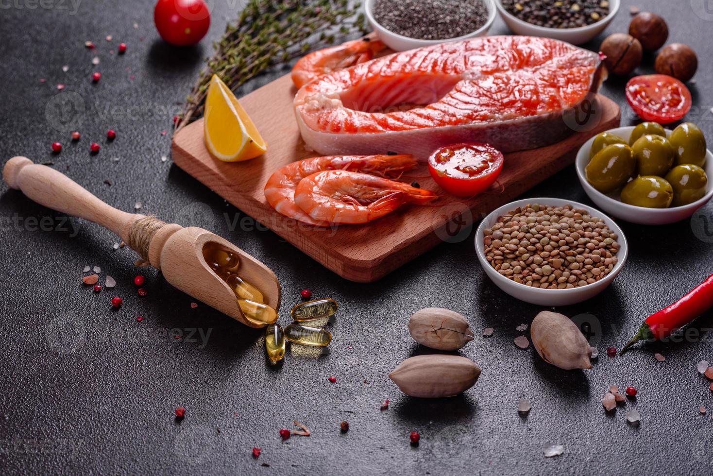 Raw trout red fish steak served with herbs and lemon photo