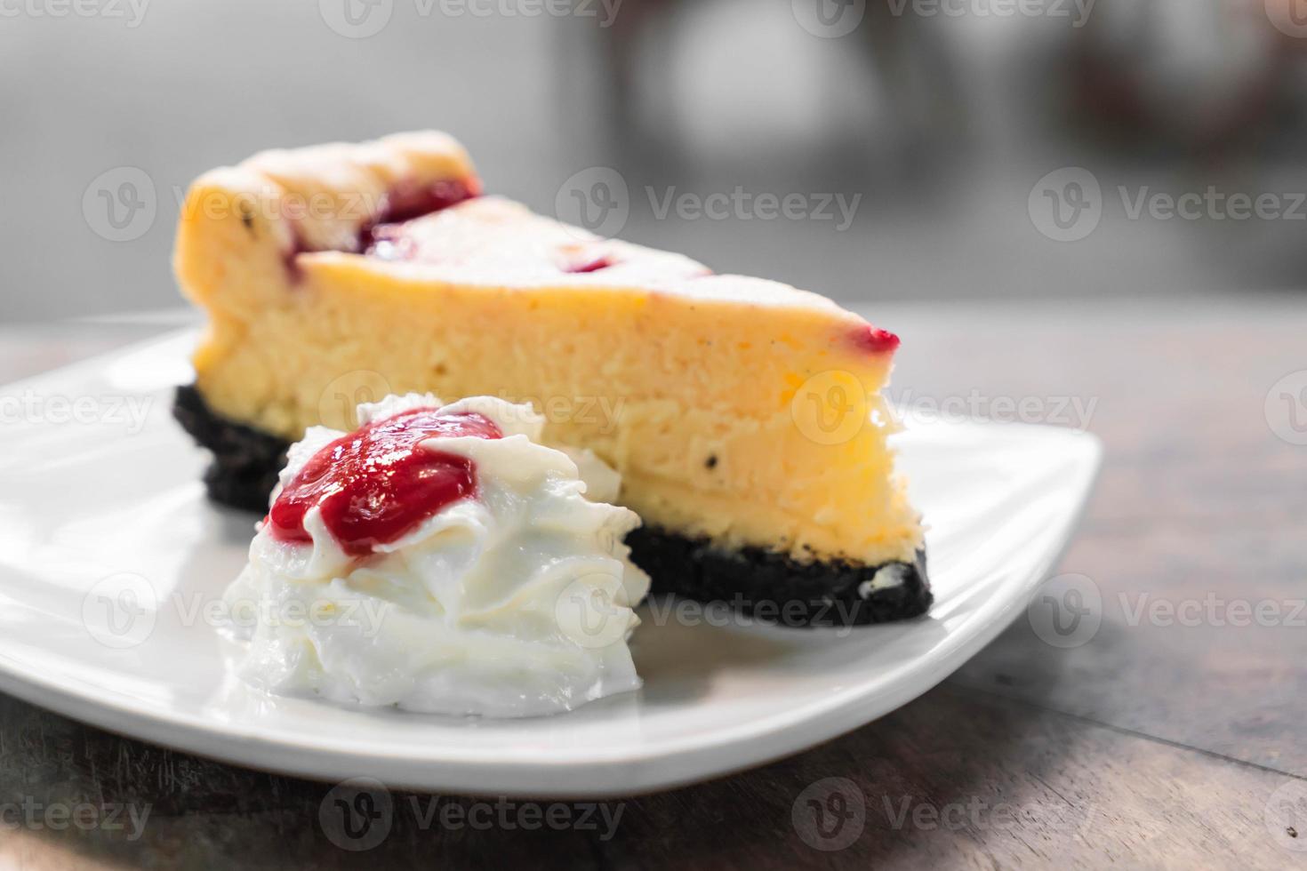 Raspberry cheese cake with whipped cream photo