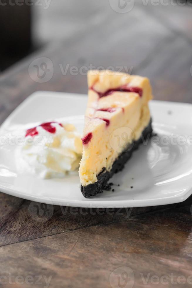 Raspberry cheese cake with whipped cream photo