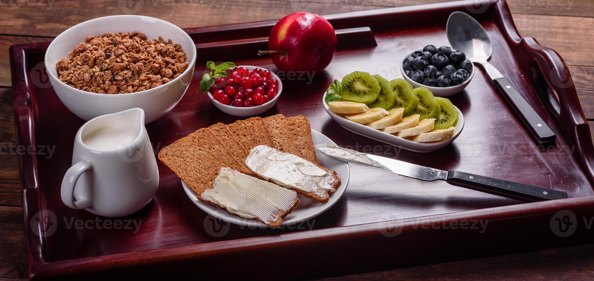 Delicious breakfast with fresh croissants and ripe berries photo