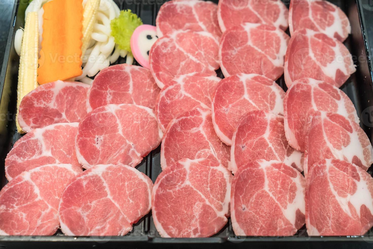 Fresh sliced pork stack on plate photo