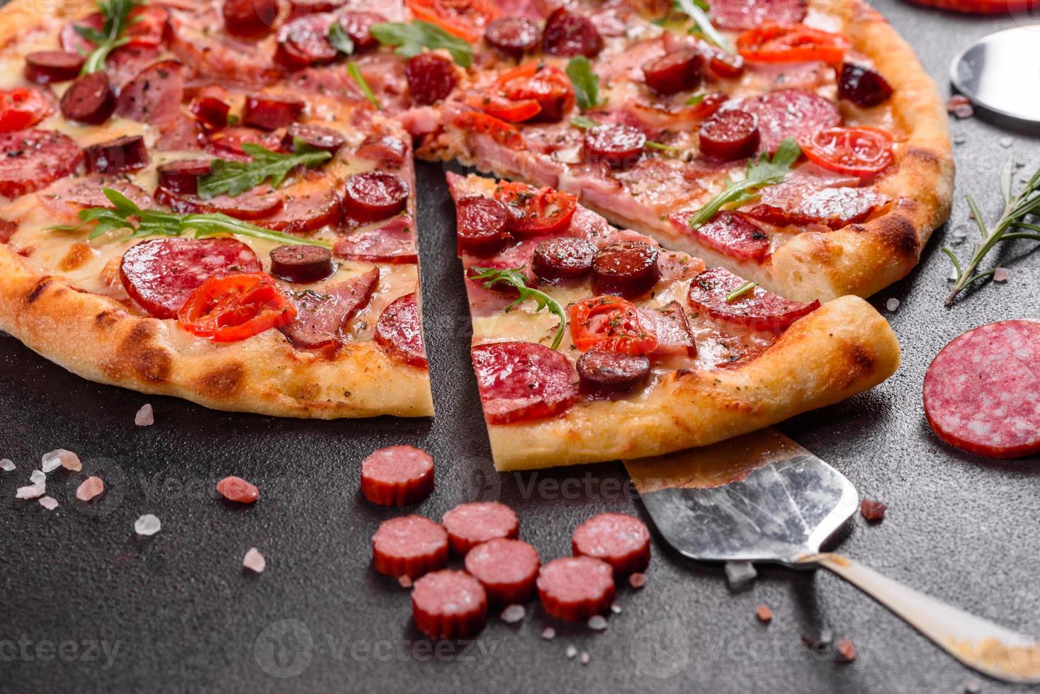 Pepperoni Pizza with Mozzarella cheese, salami and ham photo