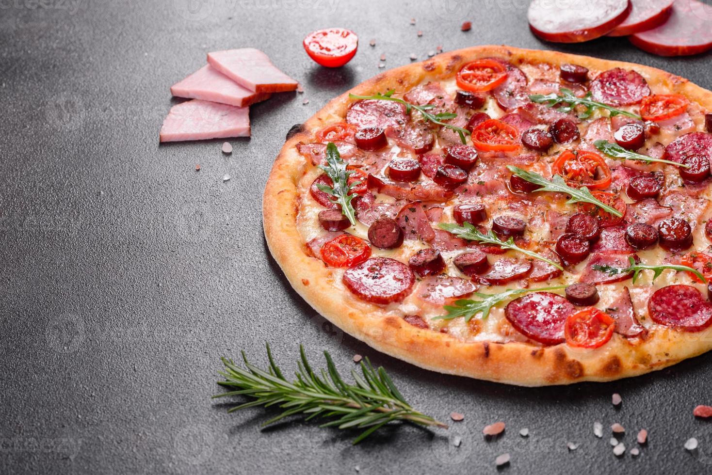 Pepperoni Pizza with Mozzarella cheese, salami and ham photo