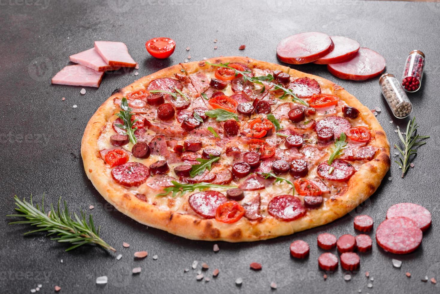 Pepperoni Pizza with Mozzarella cheese, salami and ham photo