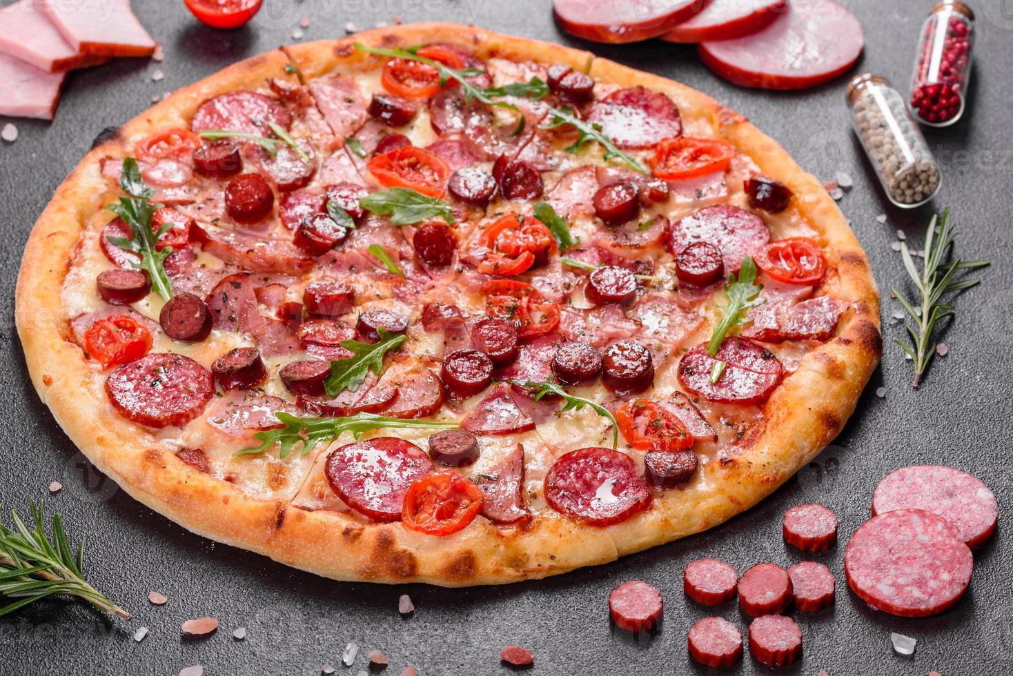 Pepperoni Pizza with Mozzarella cheese, salami and ham photo