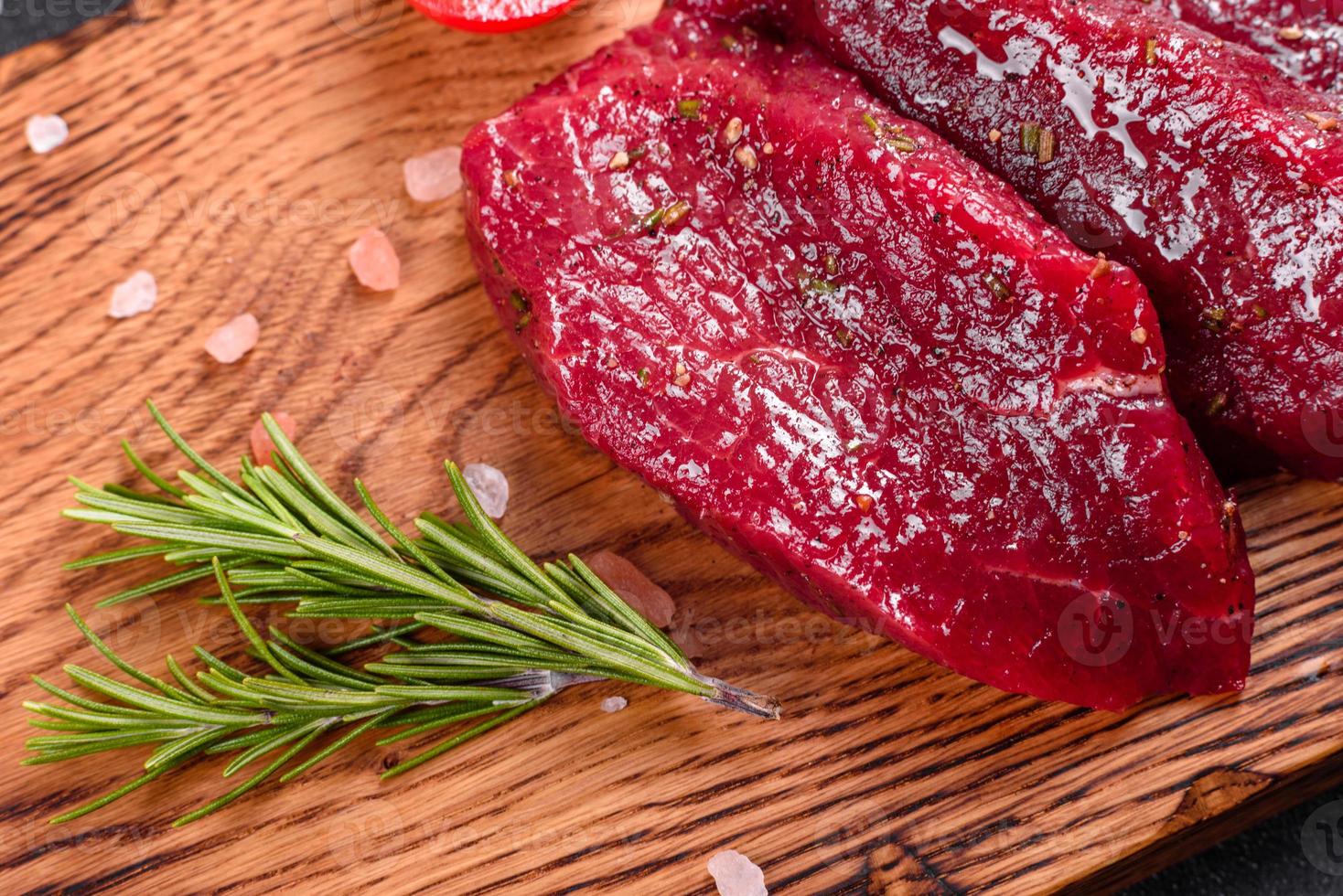 Fresh Raw Beef steak Mignon, with salt, peppercorns photo