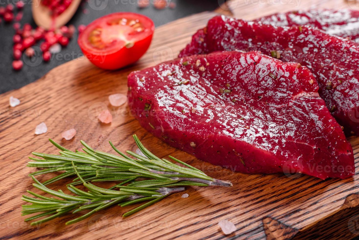 Fresh Raw Beef steak Mignon, with salt, peppercorns photo