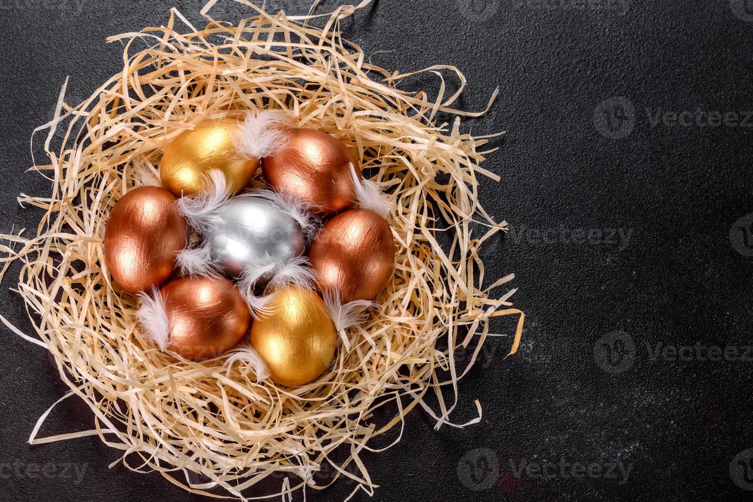 Easter golden eggs in the nest, preparation for the holiday photo