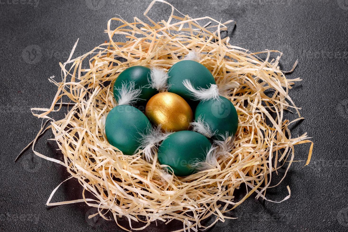 Easter golden eggs in the nest, preparation for the holiday photo