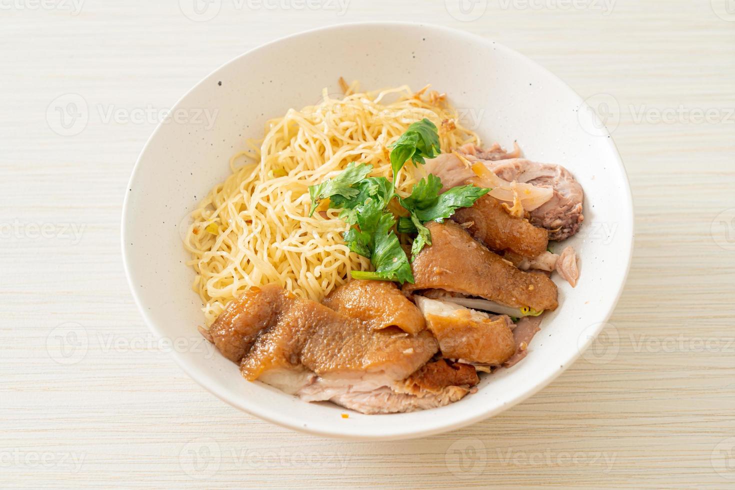 Dried stewed pork leg noodles bowl - Asian food style photo