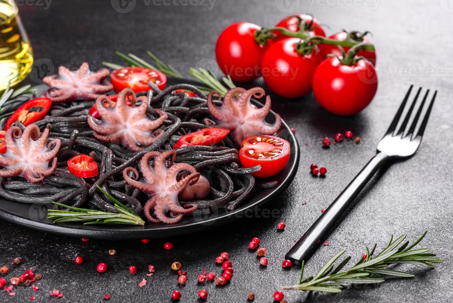 Black seafood pasta with shrimp, octopus and mussels photo