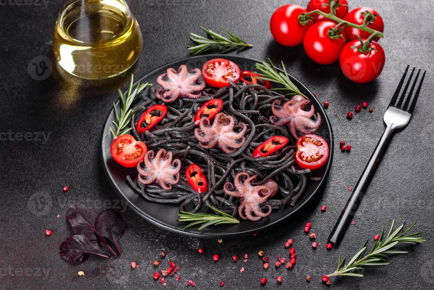 Black seafood pasta with shrimp, octopus and mussels photo