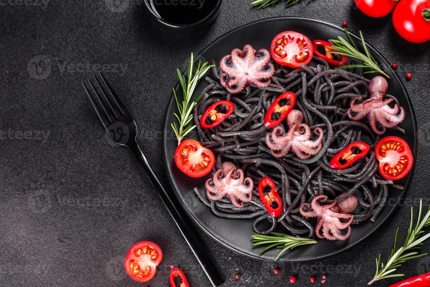 Black seafood pasta with shrimp, octopus and mussels photo