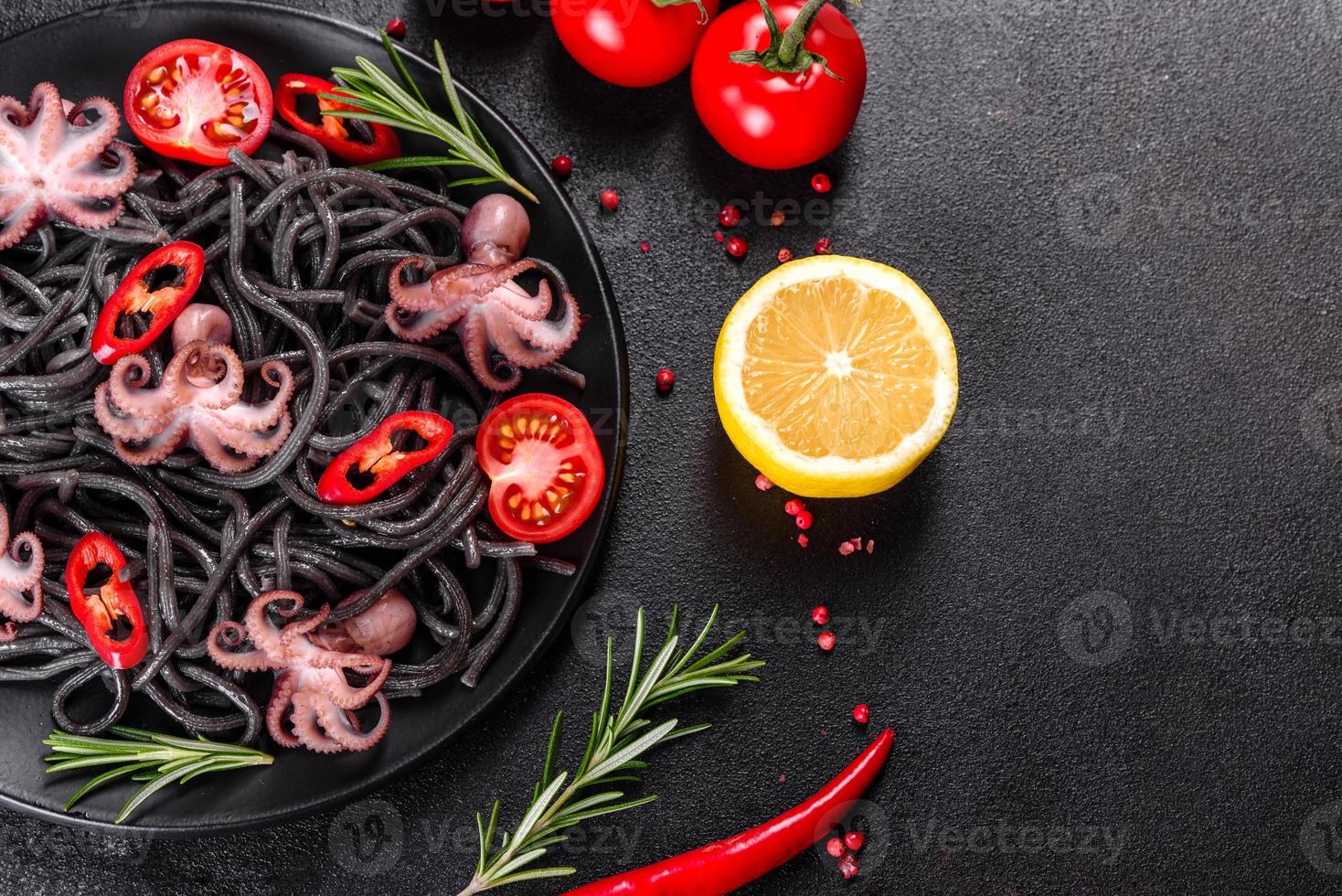 Black seafood pasta with shrimp, octopus and mussels photo