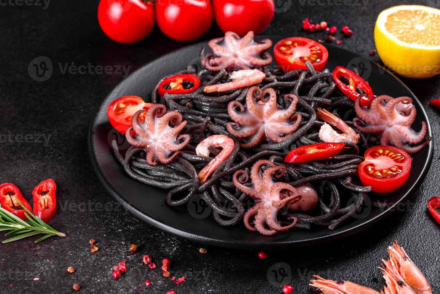 Black seafood pasta with shrimp, octopus and mussels photo