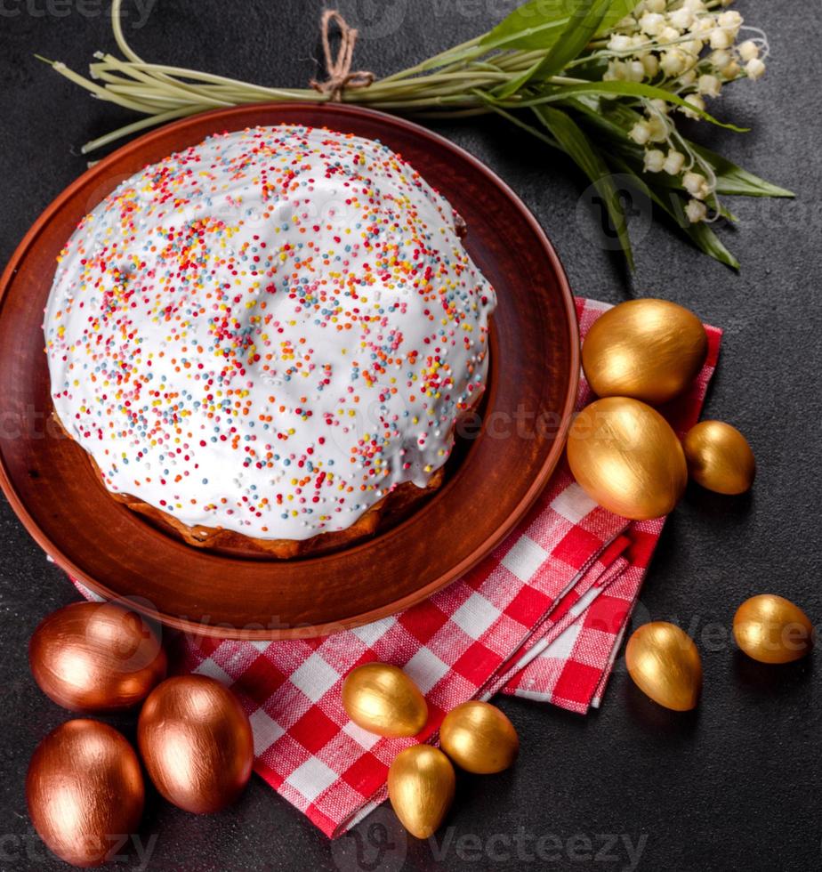 Easter eggs gold and bronze and Easter cake photo