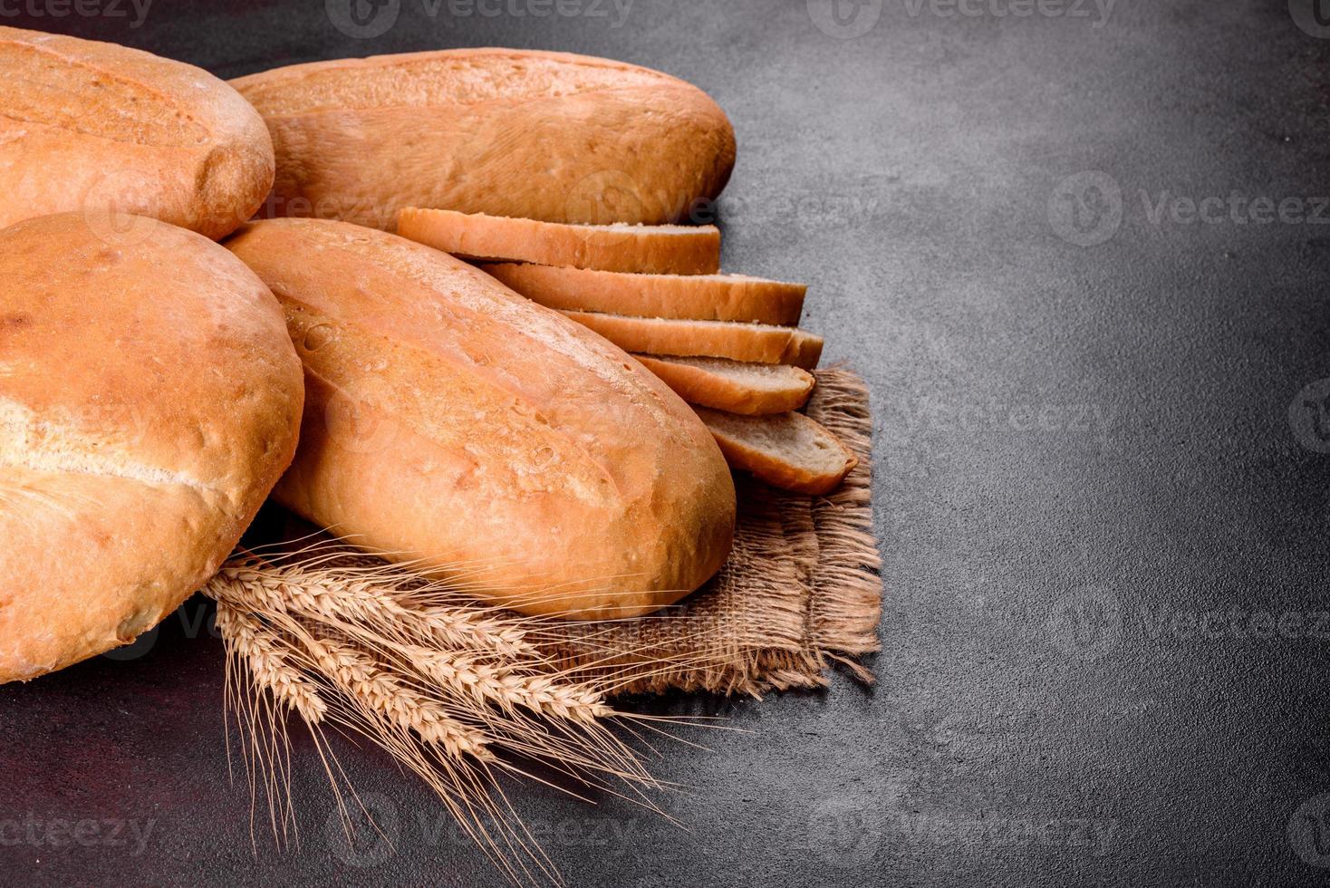 Fresh baked white bread on a brown concrete background photo