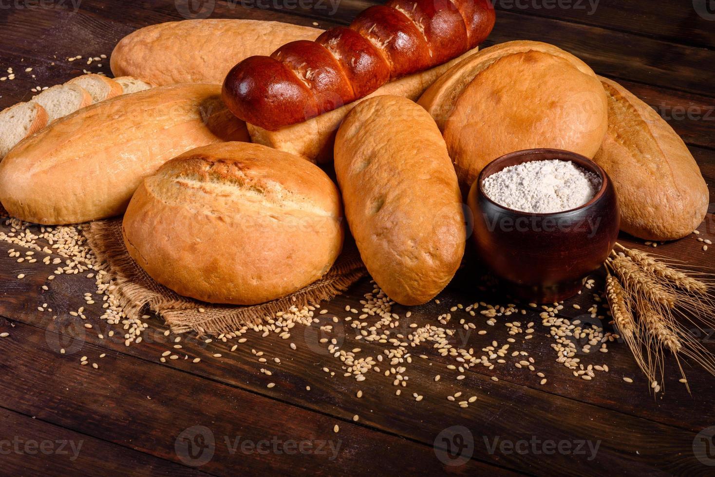 Fresh baked white bread on a brown concrete background photo