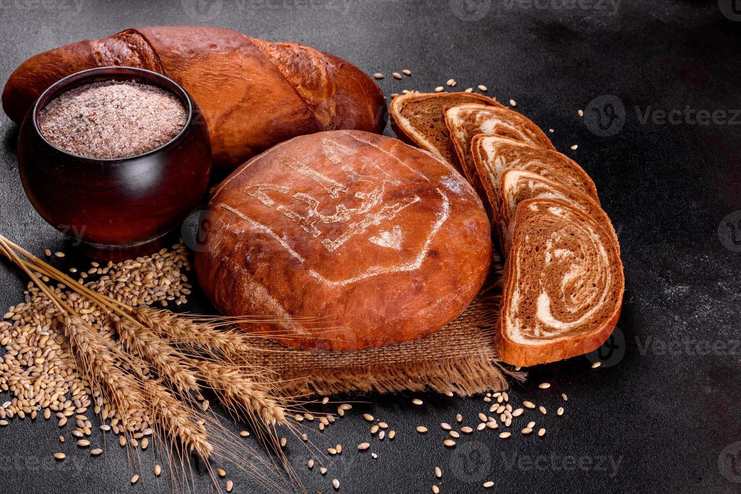 Fresh baked brown bread with coat of arms of Ukraine photo