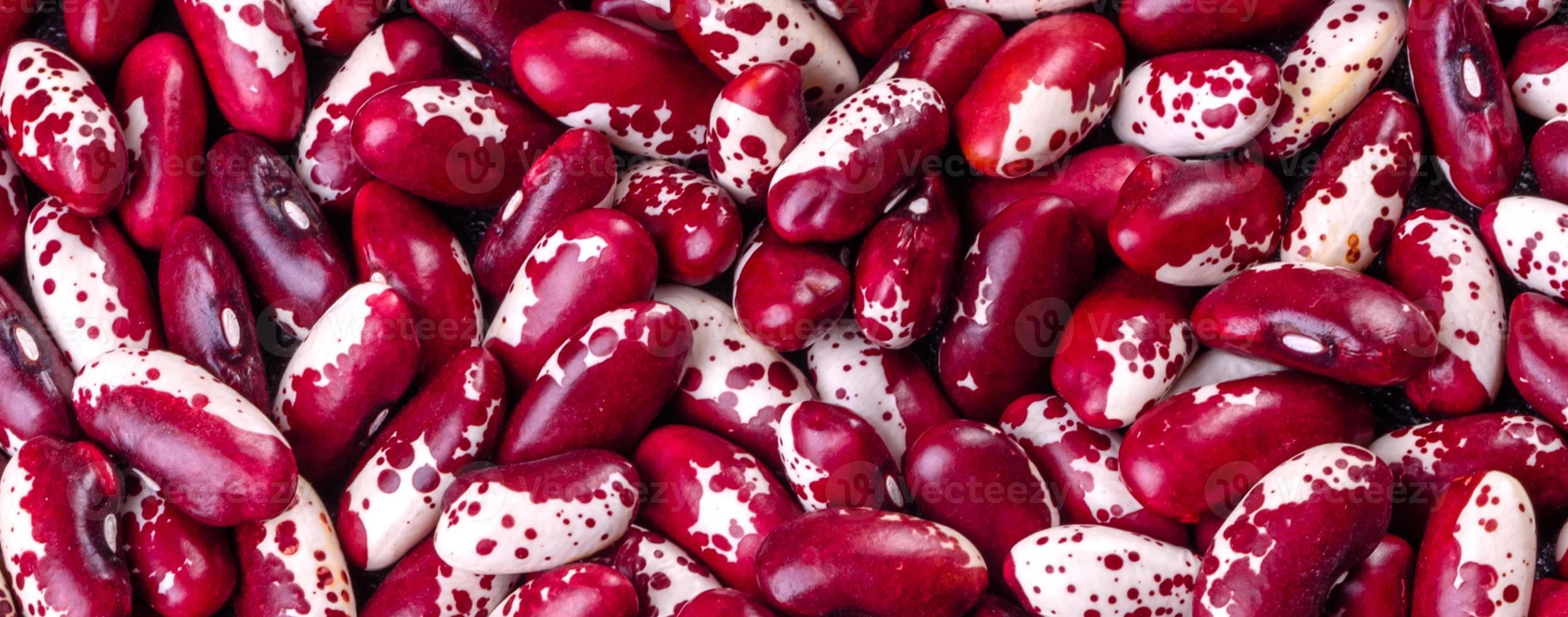Beautiful multicolored beans close-up on a concrete background photo