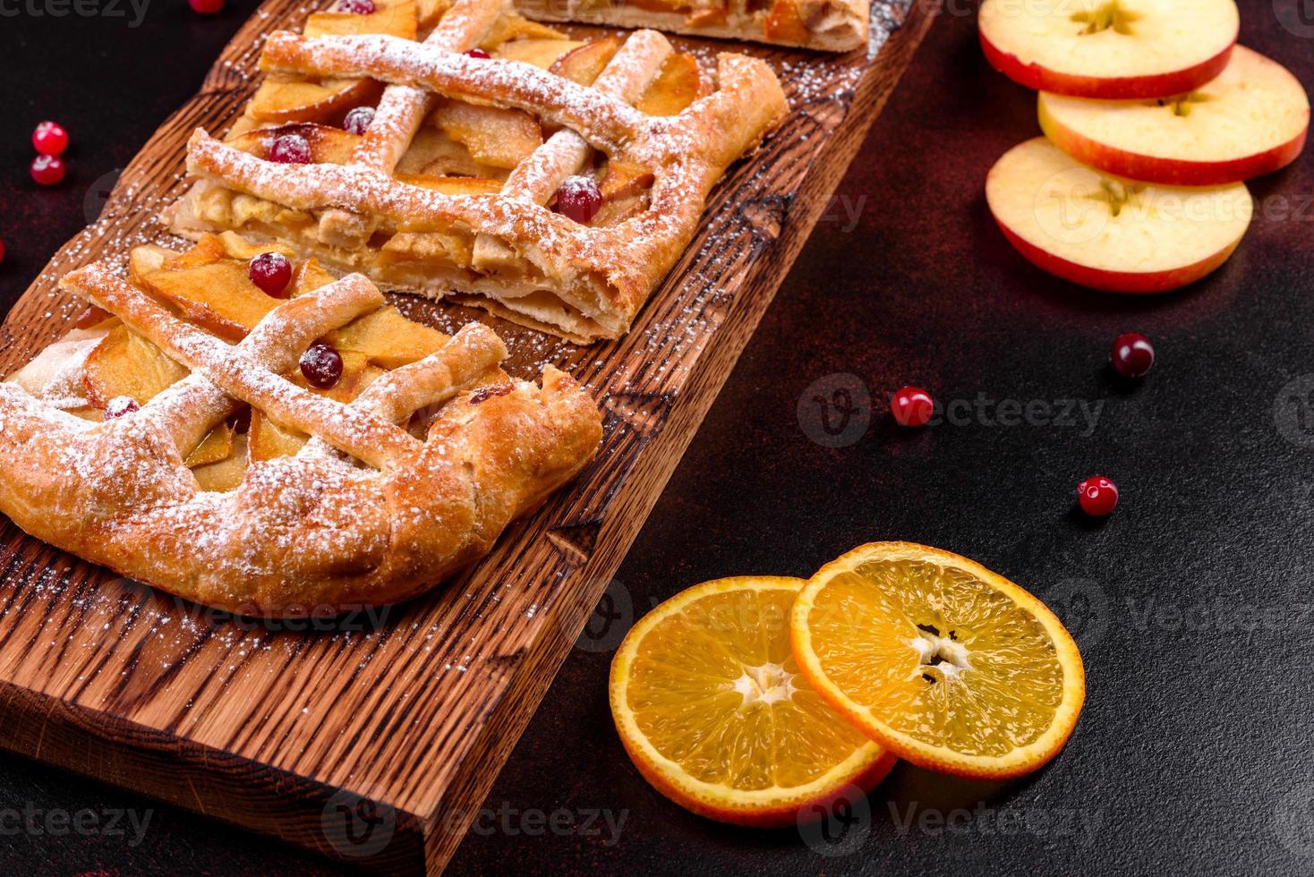 Delicious fresh pie baked with apple, pears and berries photo