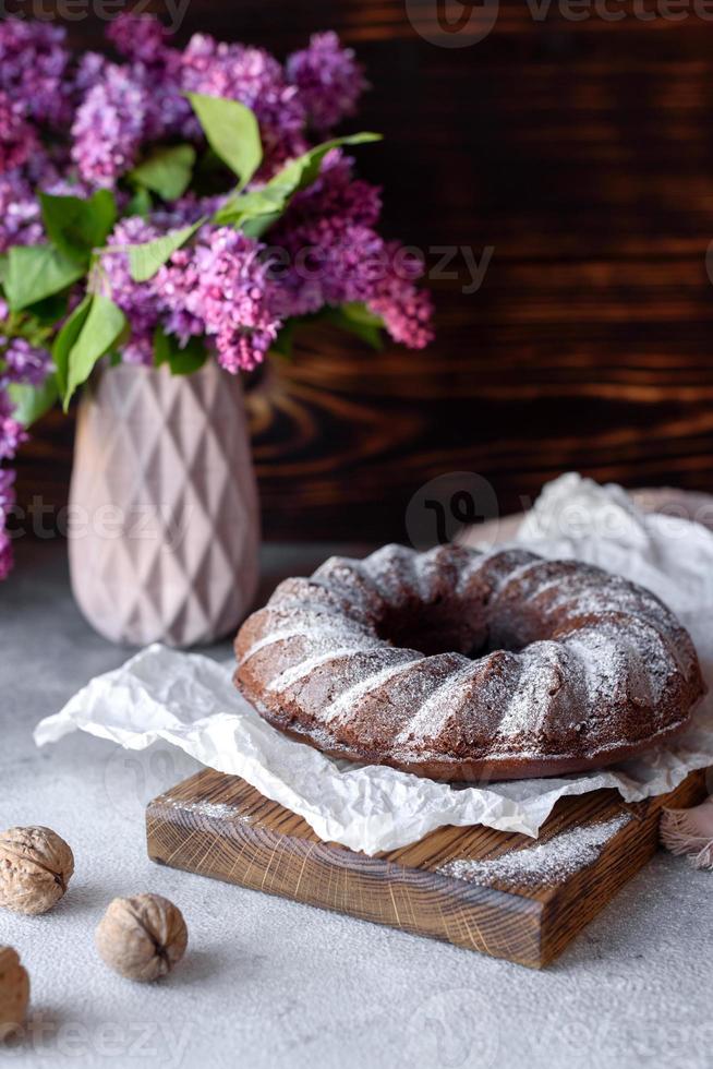 Round chocolate coffee cupcake with raisins and poppy photo