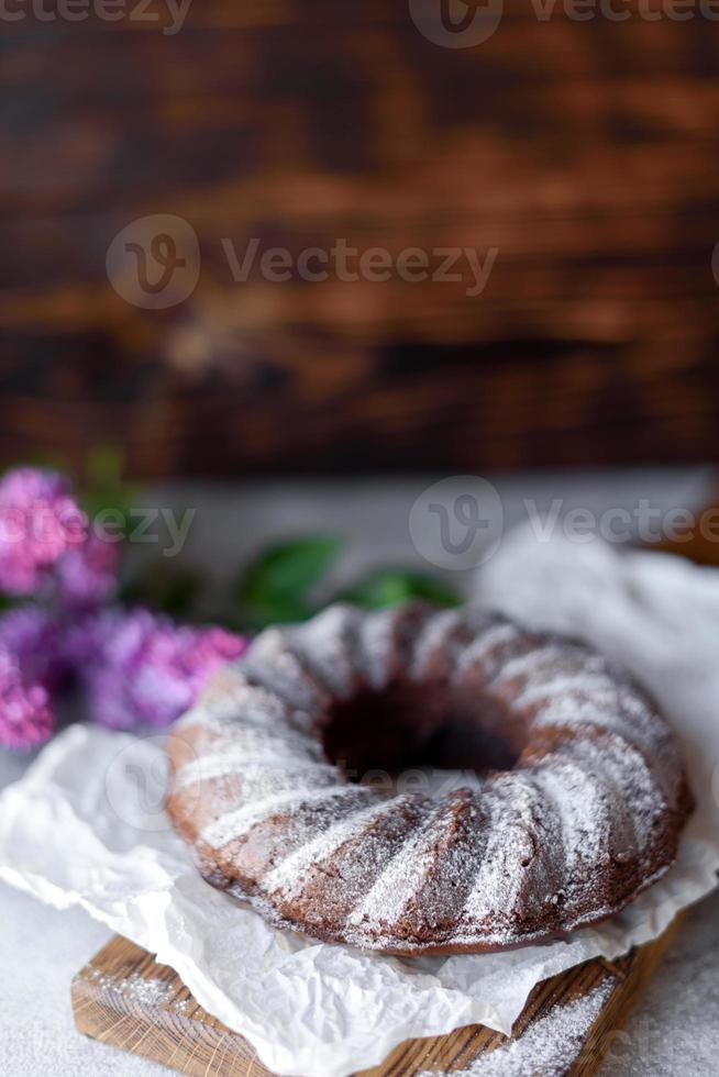Round chocolate coffee cupcake with raisins and poppy photo