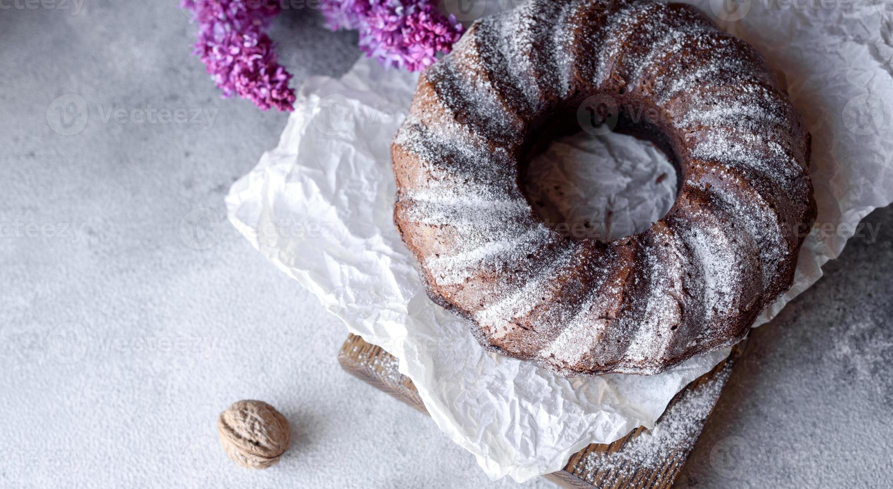 Round chocolate coffee cupcake with raisins and poppy photo