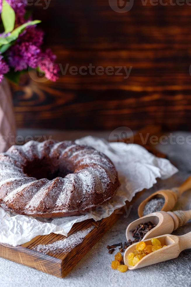 Round chocolate coffee cupcake with raisins and poppy photo