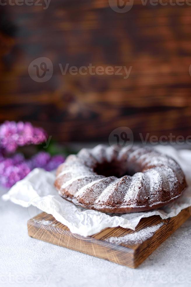 Round chocolate coffee cupcake with raisins and poppy photo