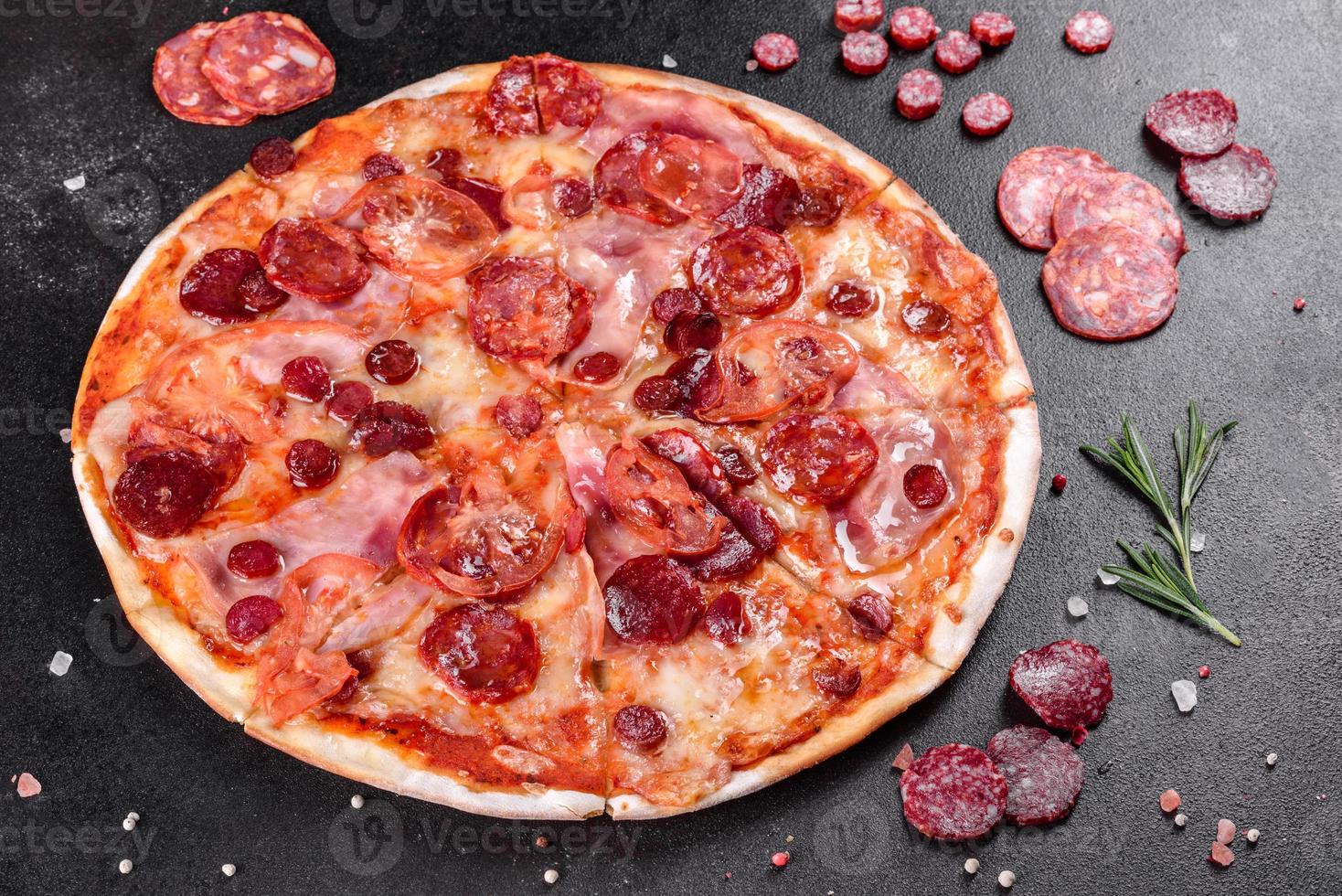 Pepperoni pizza with mozzarella cheese photo