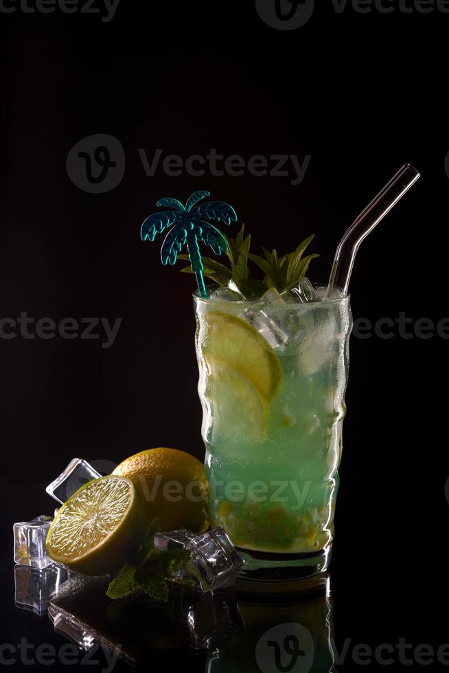 Mojito cocktail over black background photo