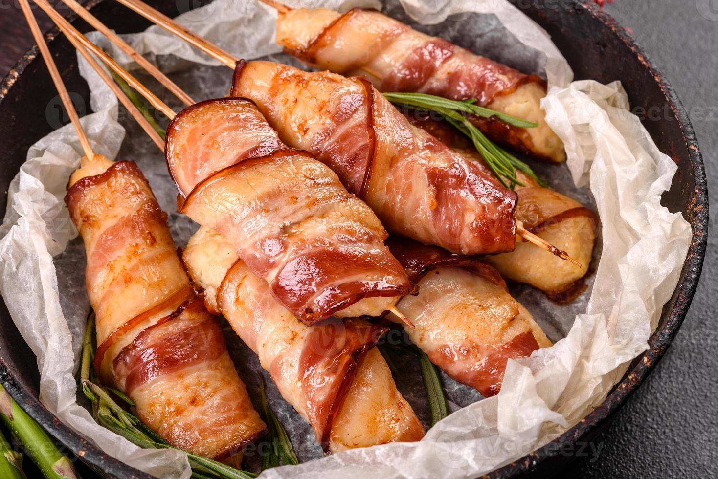 Roll with bacon and chicken mince on a stew with fresh asparagus photo