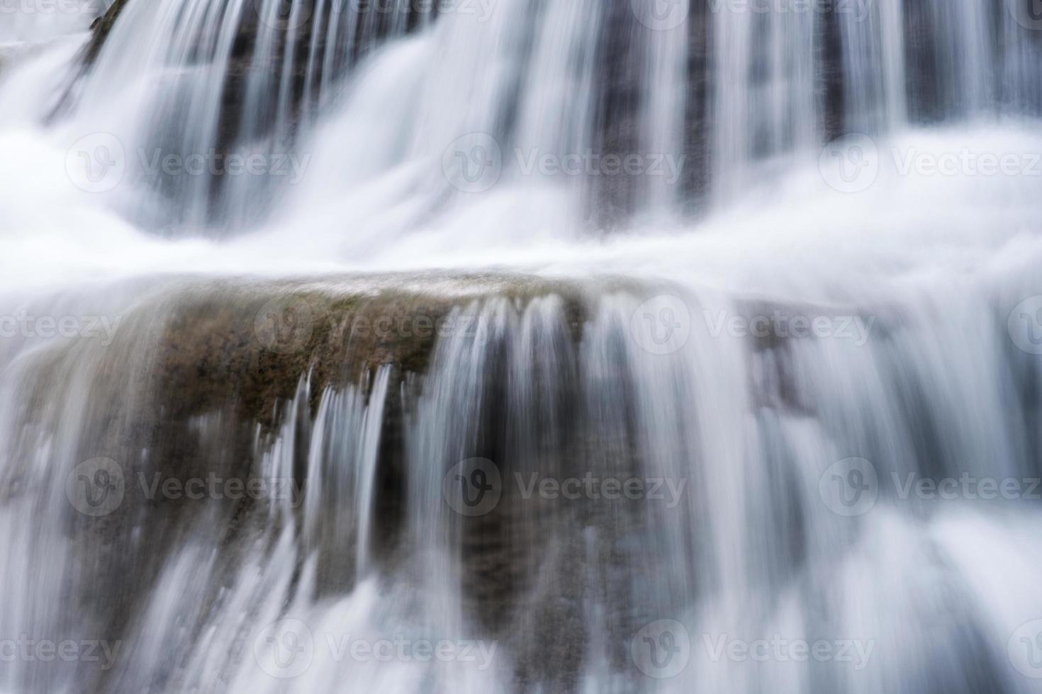 Waterfall flowing fall on limestone photo