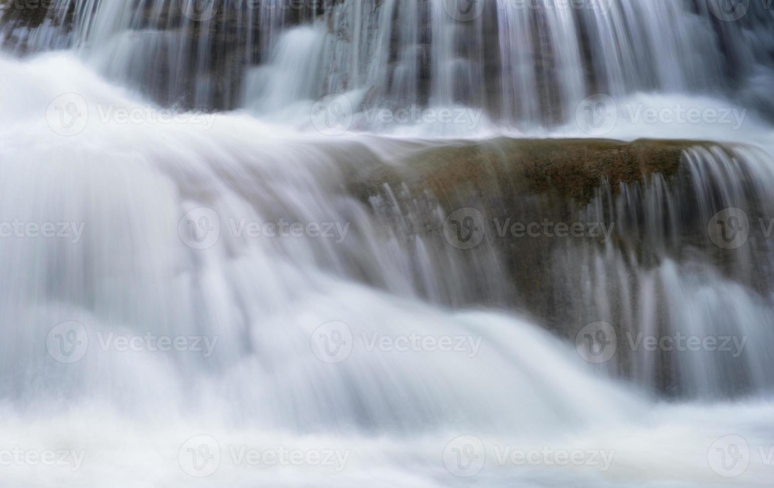 Waterfall flowing on limestone photo