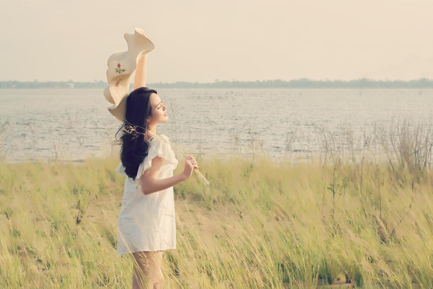 Beautiful young woman enjoying the fabulous nature photo